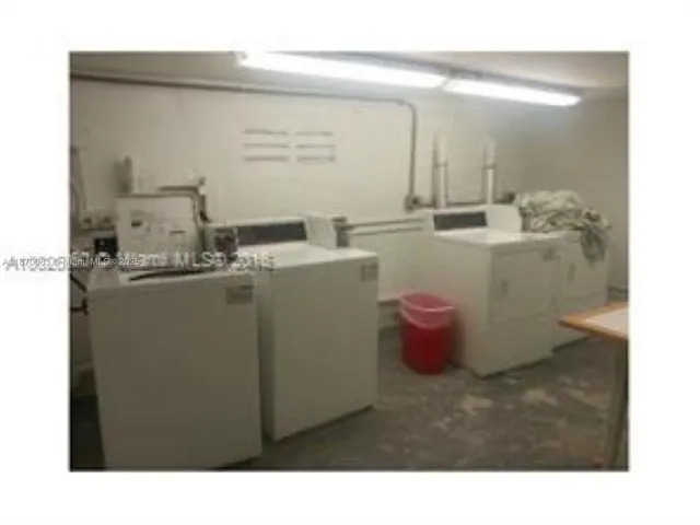 a view of a tall building with a yard