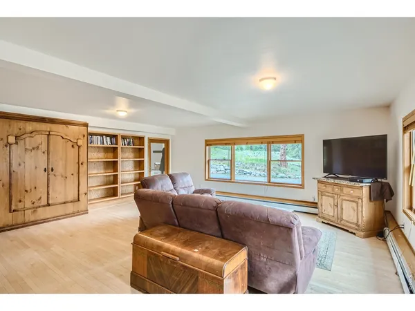 a view of balcony with furniture and wooden floor