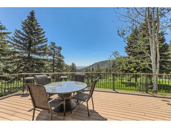 a view of a deck with a yard