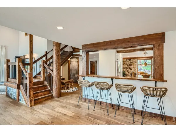 a livingroom with furniture and stairs