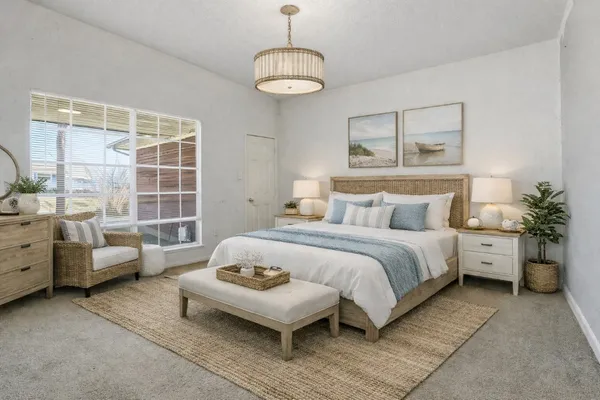 a bedroom with a bed and a couch