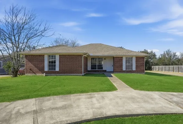 front view of a house and a yard