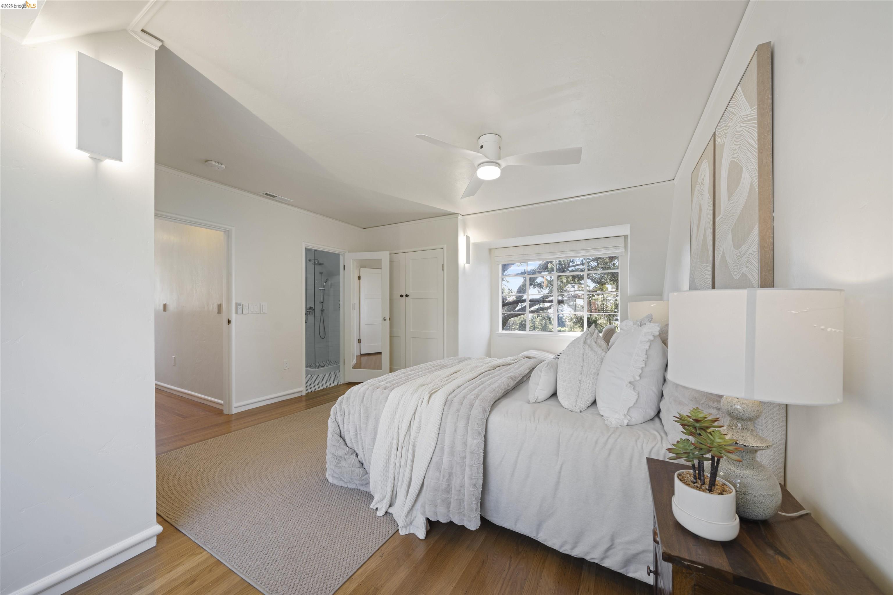 1170 Sterling Avenue Berkeley, CA 94708 - Photo 28 of 52 Bedroom with wood finished floors, ceiling fan, and connected bathroom