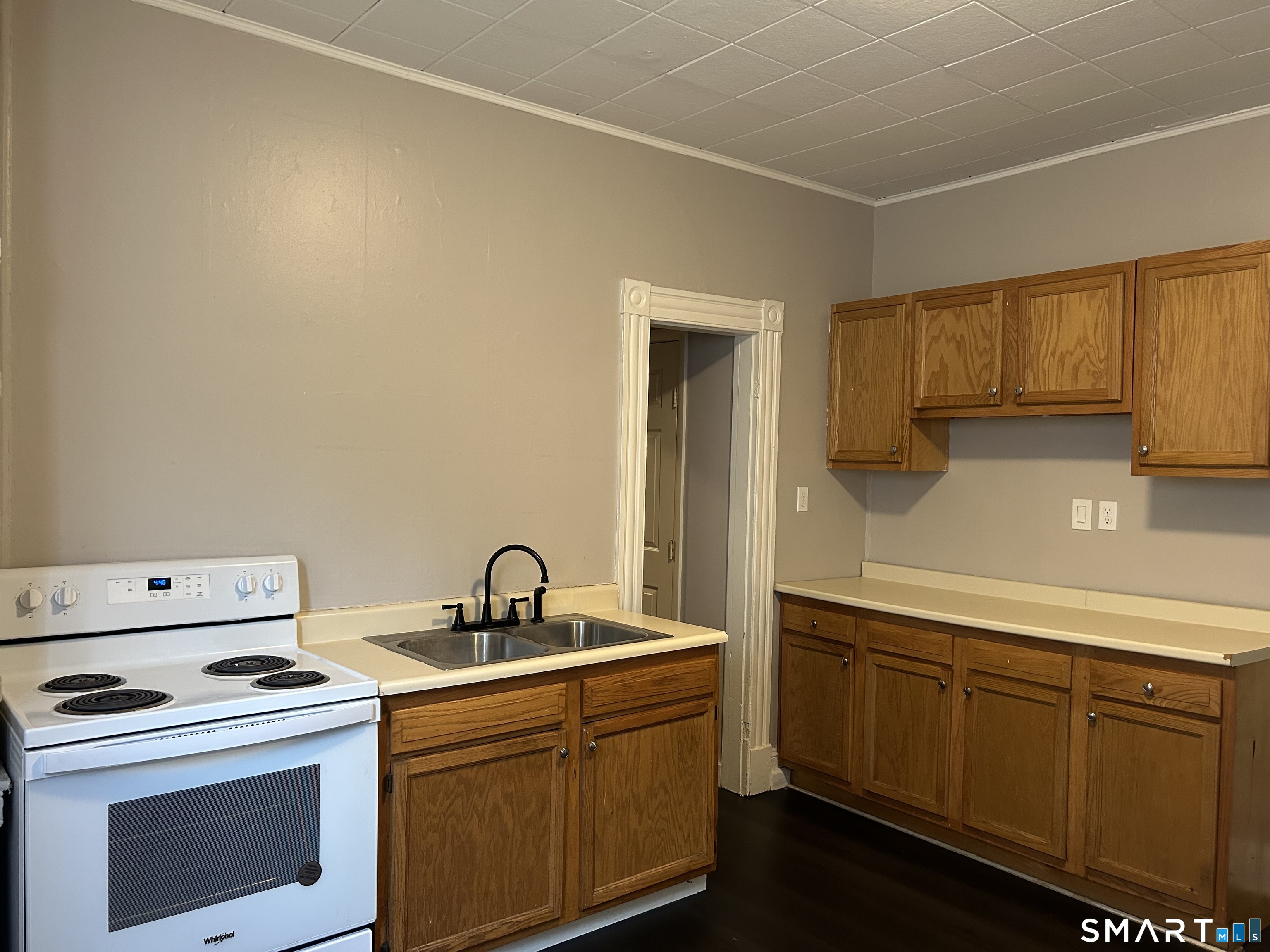 68 Anderson Street Naugatuck, CT 06770 - Photo 2 of 7 a kitchen with a sink stove and cabinets