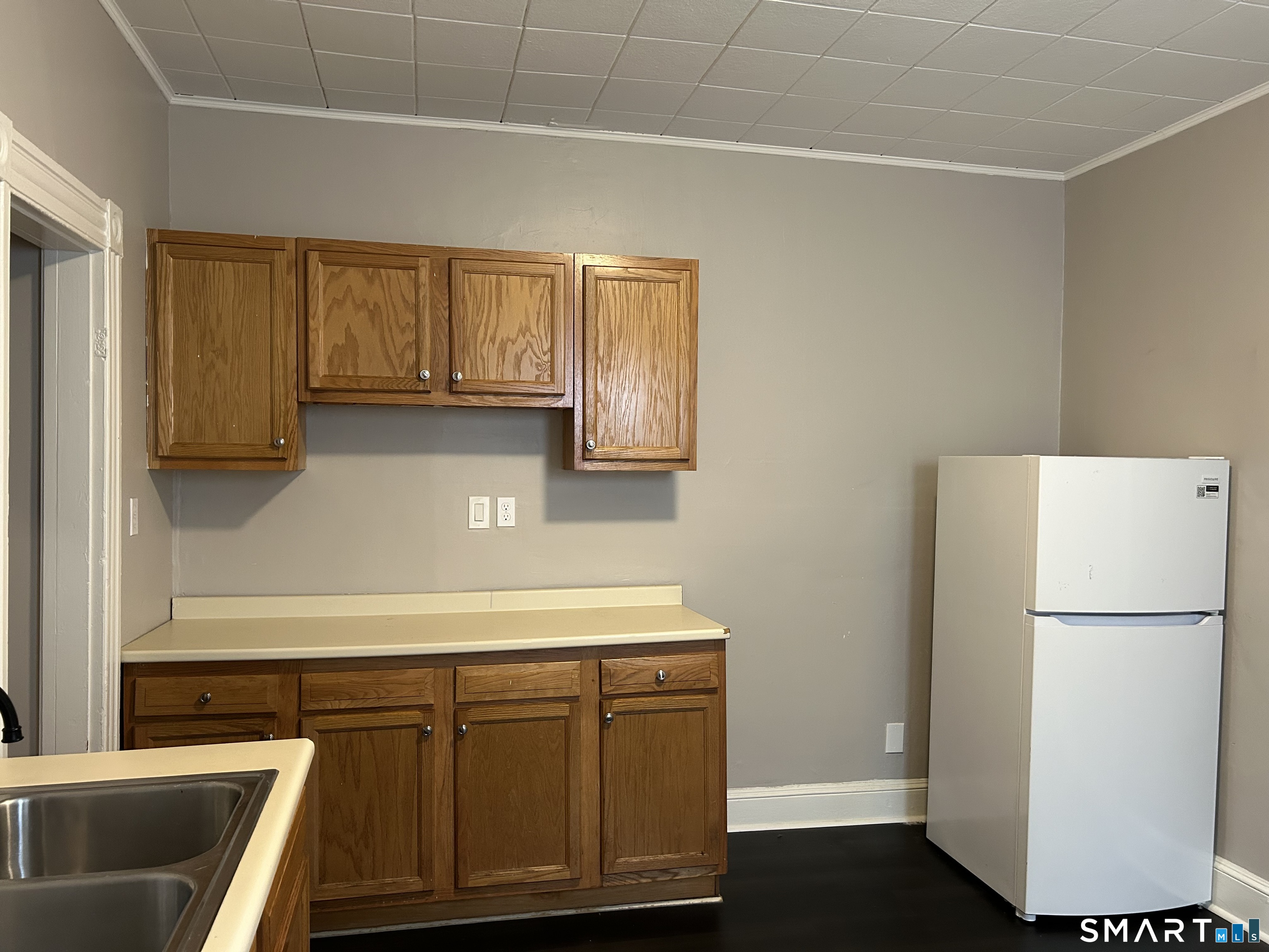 68 Anderson Street Naugatuck, CT 06770 - Photo 3 of 7 a kitchen with a refrigerator sink and cabinets