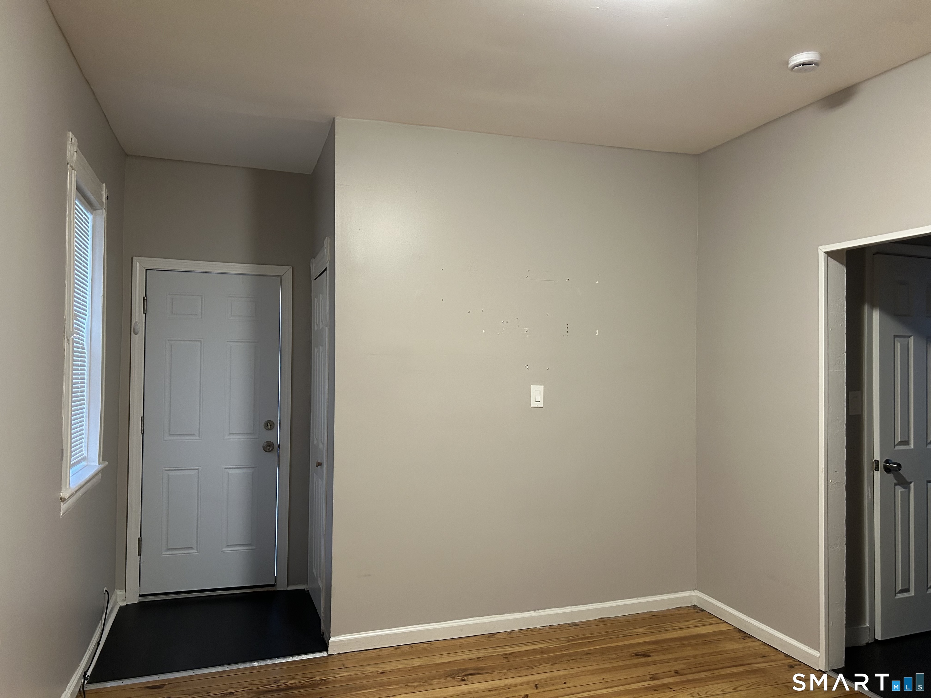 68 Anderson Street Naugatuck, CT 06770 - Photo 5 of 7 a view of a room with wooden floor and closet