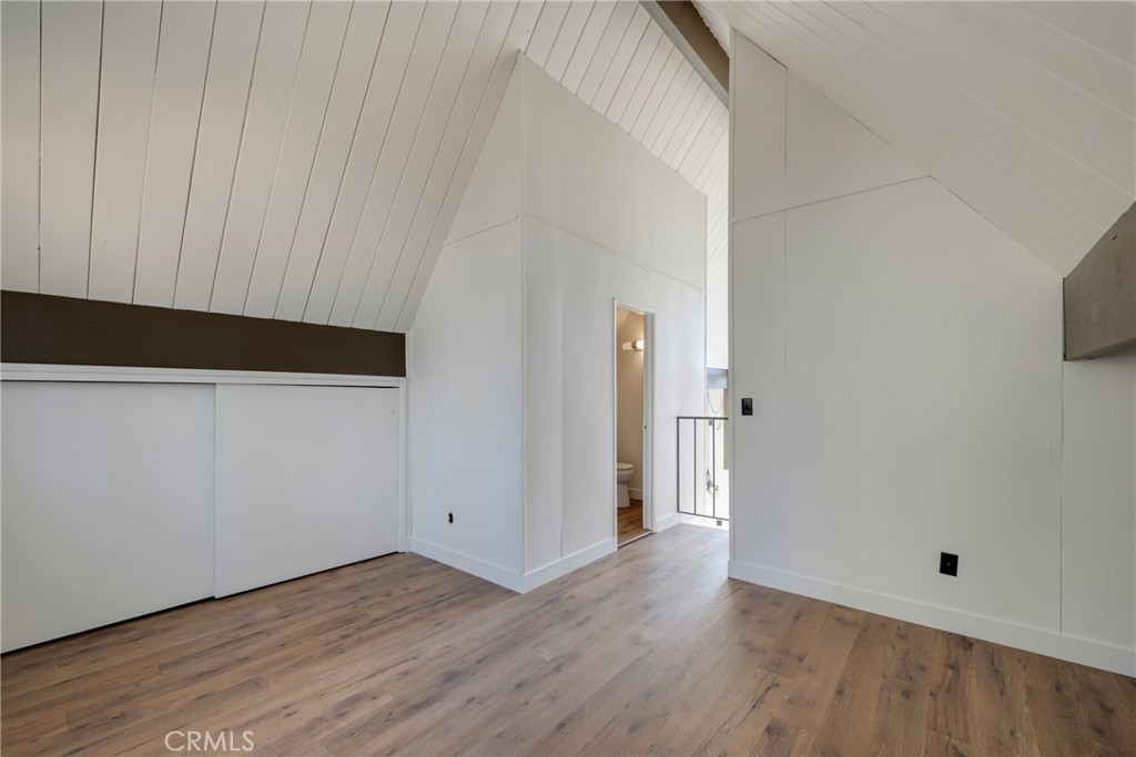 743 Rhine Road Lake Arrowhead, CA 92352 - Photo 14 of 30 a view of an empty room with wooden floor