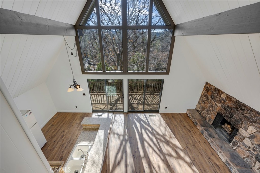 743 Rhine Road Lake Arrowhead, CA 92352 - Photo 15 of 30 a bedroom with a bed and wooden floor