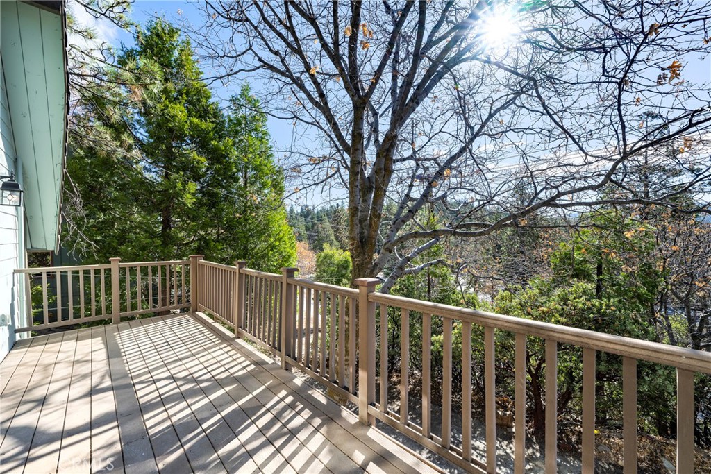 743 Rhine Road Lake Arrowhead, CA 92352 - Photo 16 of 30 a balcony of view with wooden floor and fence