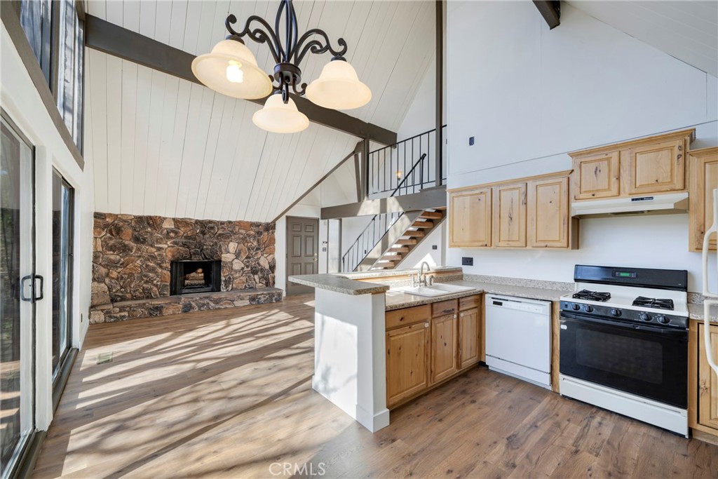 743 Rhine Road Lake Arrowhead, CA 92352 - Photo 9 of 30 a kitchen with stainless steel appliances granite countertop a stove and a sink