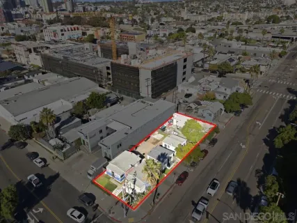 an aerial view of a house with a yard