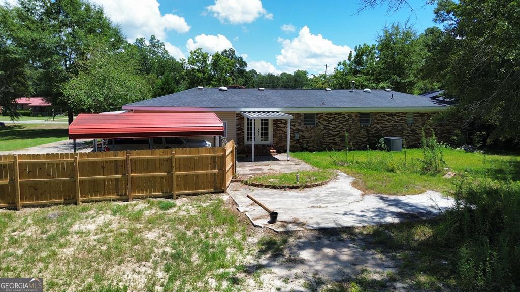 108 Plum Street Dublin, GA 31021 - Photo 5 of 33 a view of a house with a yard