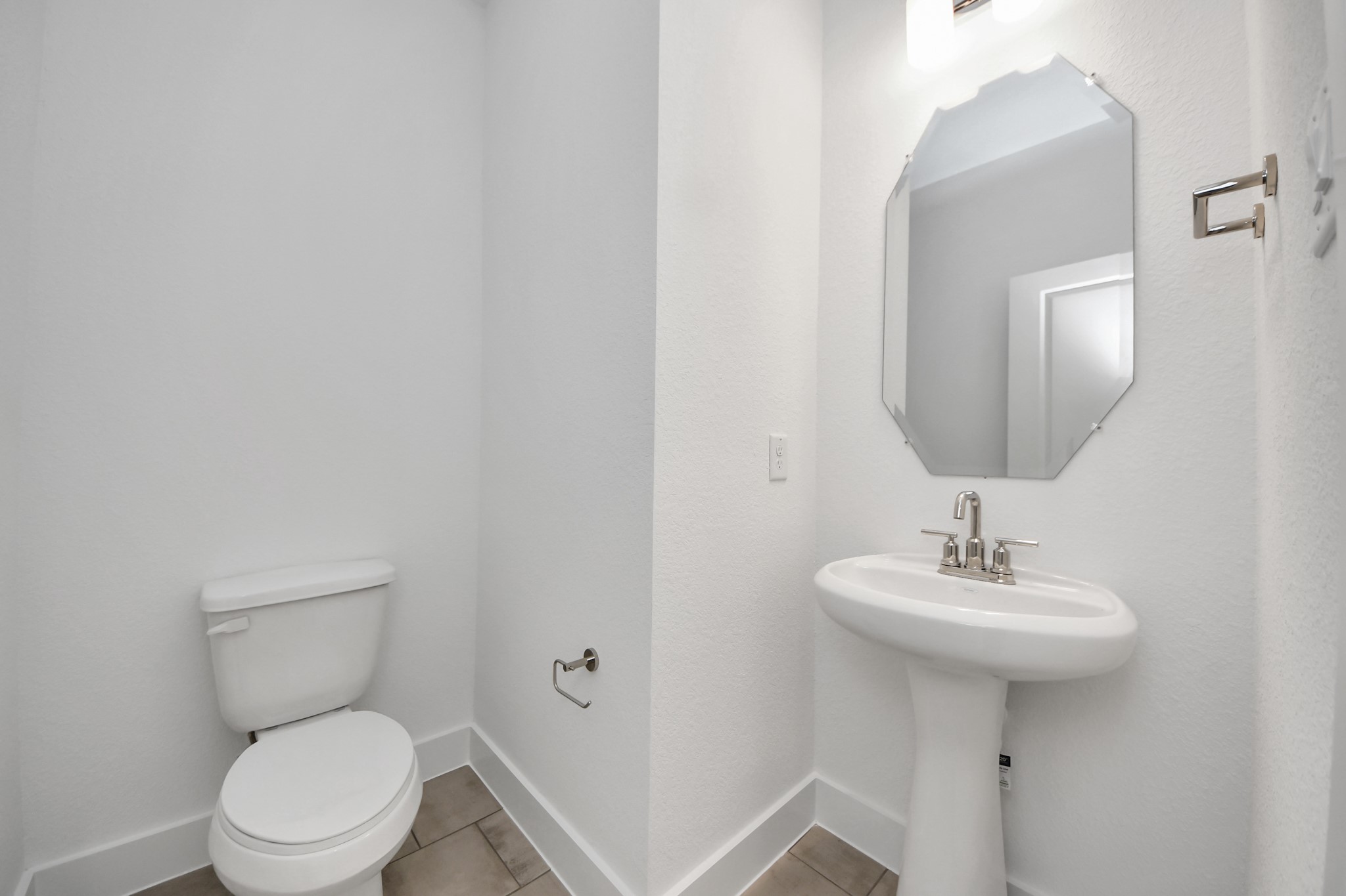 14471 Trumpet Lane Splendora, TX 77372 - Photo 12 of 33 a bathroom with a toilet sink and mirror