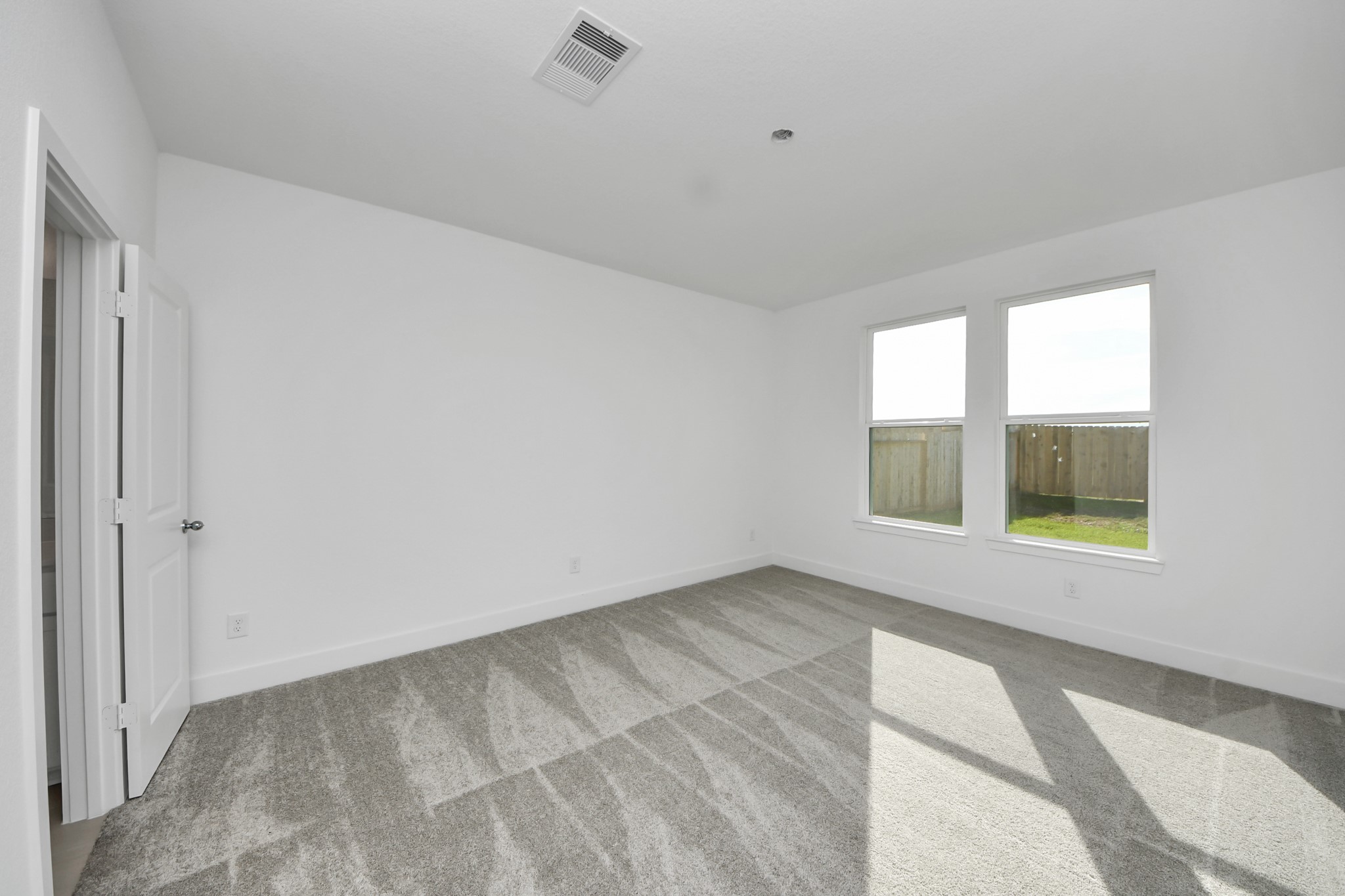 14471 Trumpet Lane Splendora, TX 77372 - Photo 13 of 33 a view of an empty room with a window