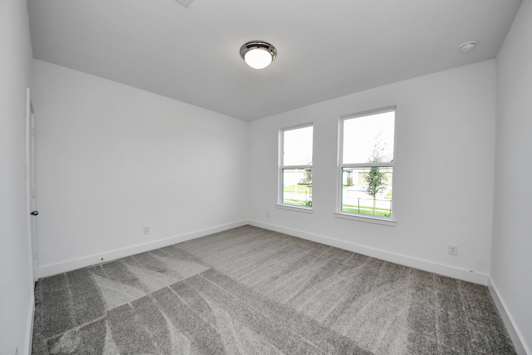 14471 Trumpet Lane Splendora, TX 77372 - Photo 17 of 33 an empty room with windows