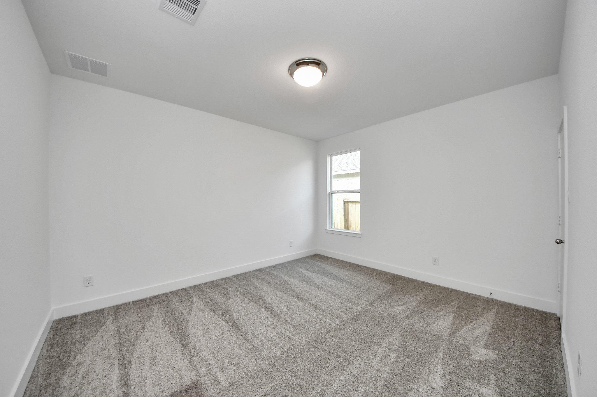 14471 Trumpet Lane Splendora, TX 77372 - Photo 19 of 33 a view of empty room with window
