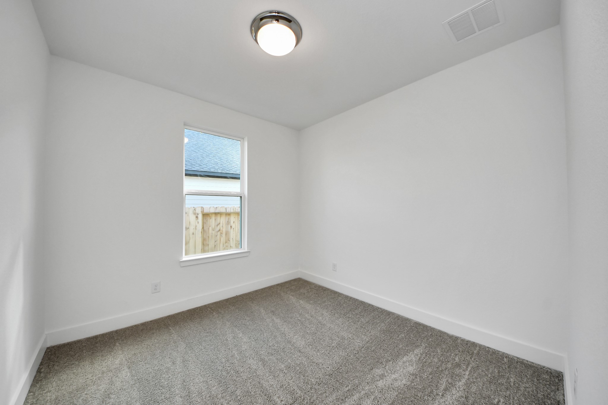 14471 Trumpet Lane Splendora, TX 77372 - Photo 20 of 33 an empty room with a window