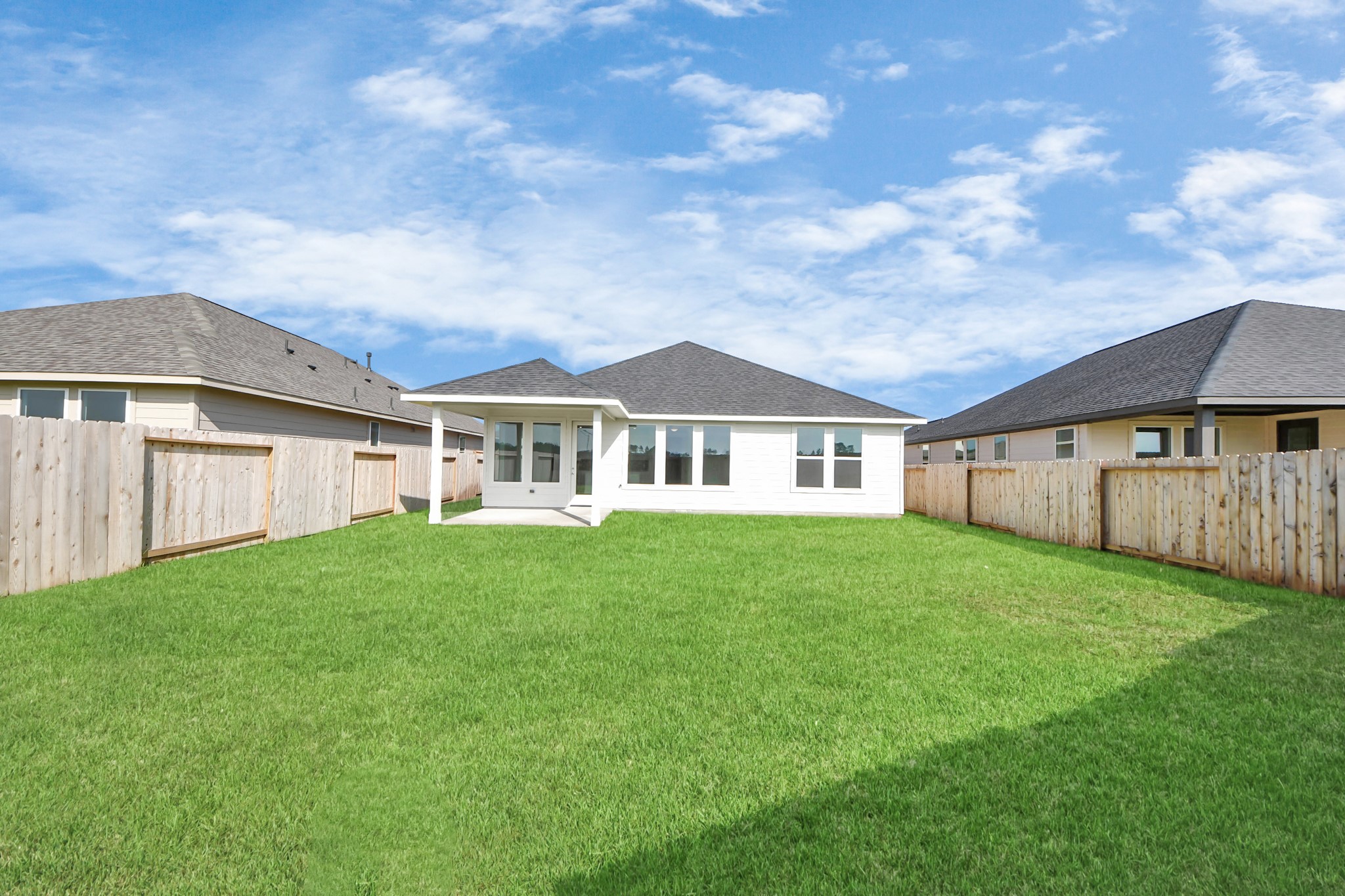 14471 Trumpet Lane Splendora, TX 77372 - Photo 23 of 33 a view of a yard in front of a house with large tree