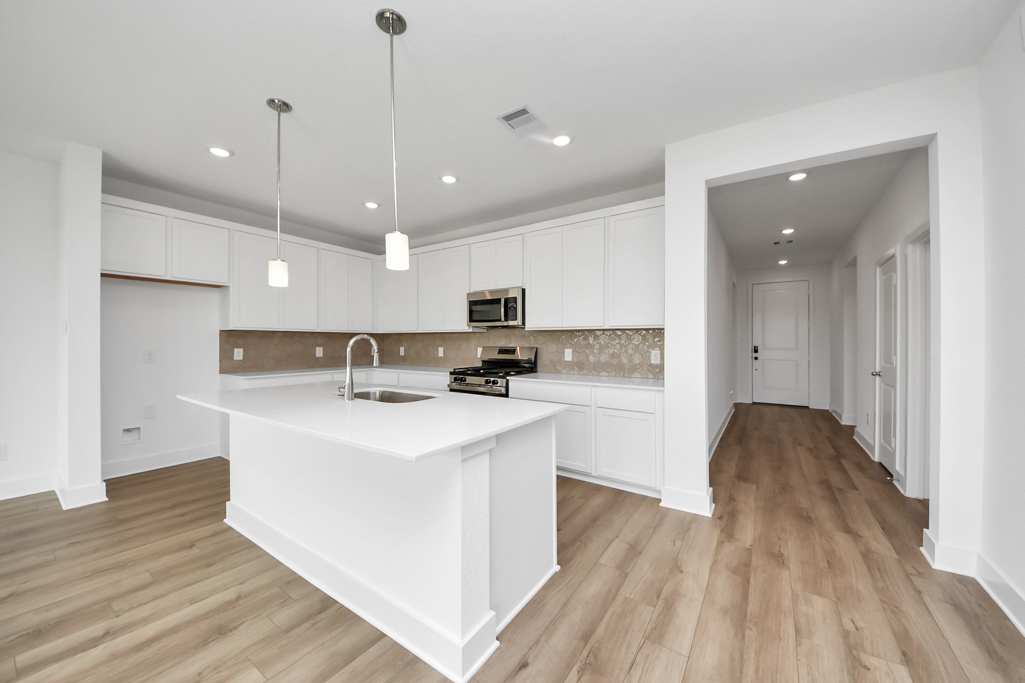 14471 Trumpet Lane Splendora, TX 77372 - Photo 4 of 33 a view of kitchen with sink microwave and refrigerator