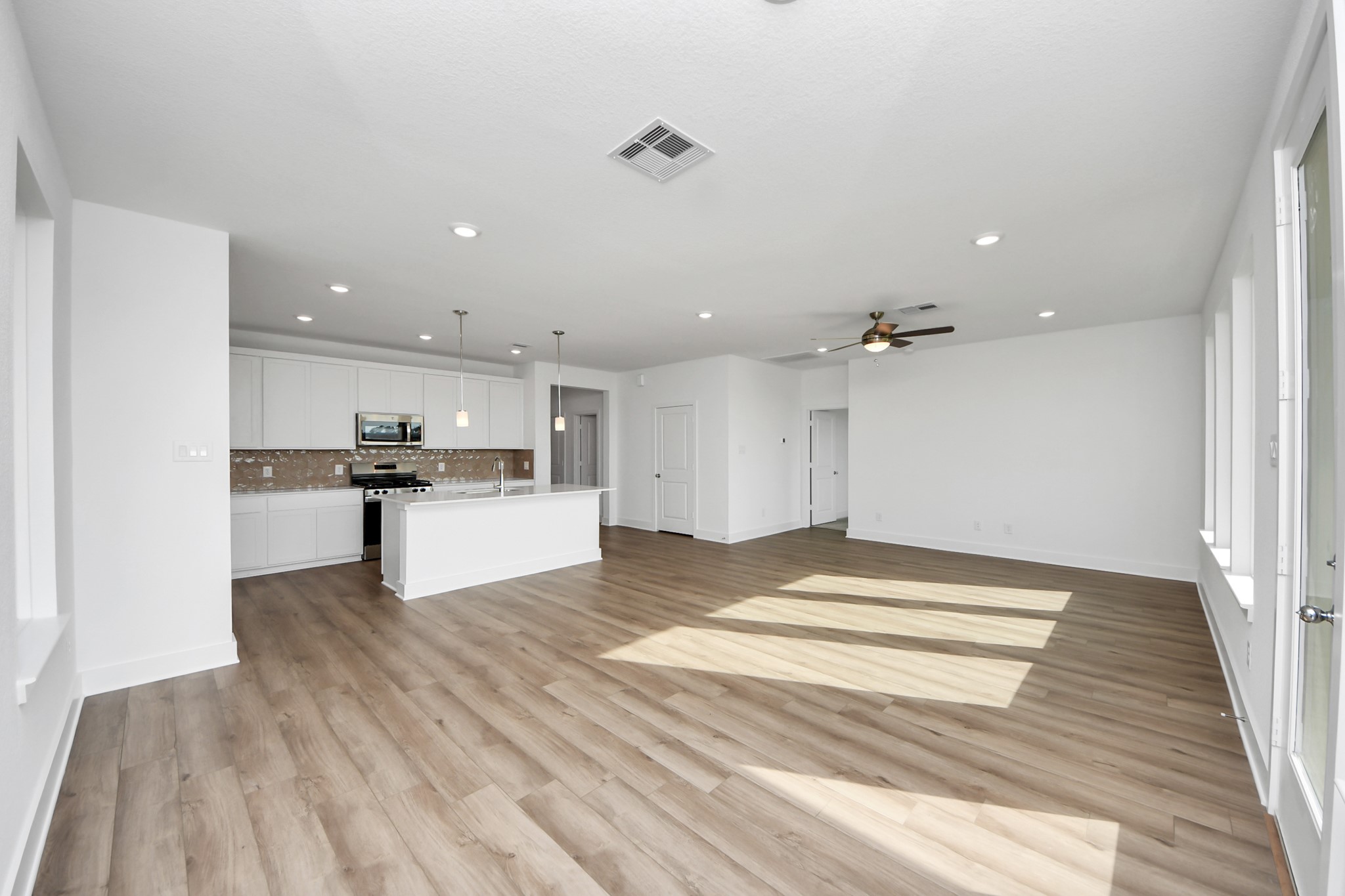 14471 Trumpet Lane Splendora, TX 77372 - Photo 9 of 33 a view of kitchen refrigerator and microwave