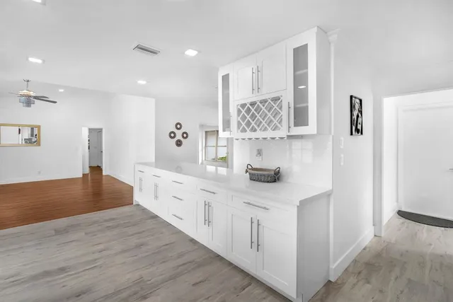 a kitchen with stainless steel appliances granite countertop a sink and a microwave