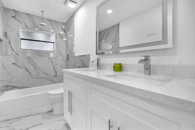 a view of a room with wooden floor and windows