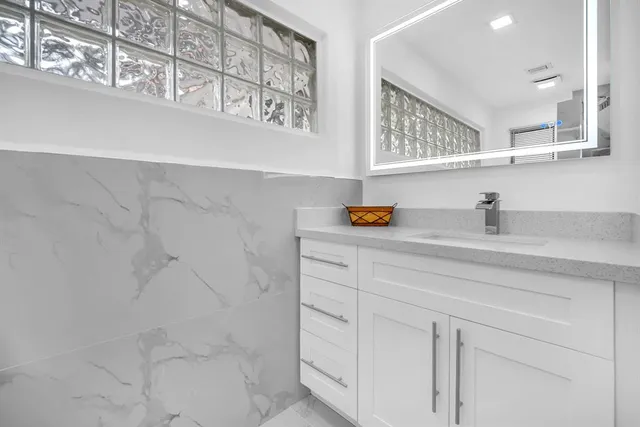 a view of empty room with sliding window