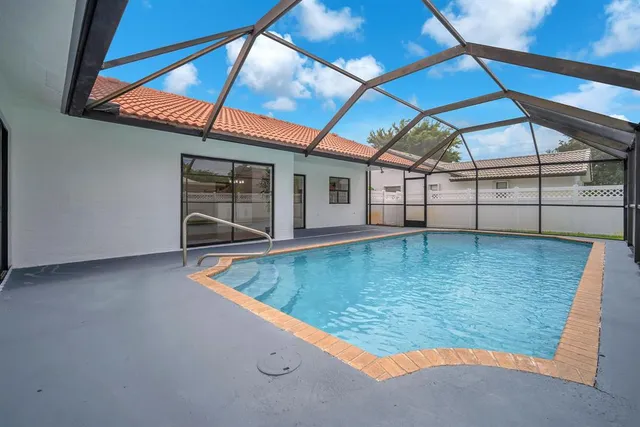 a view of a backyard with a sitting area