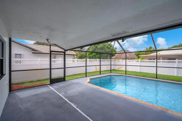 an aerial view of a house with outdoor space