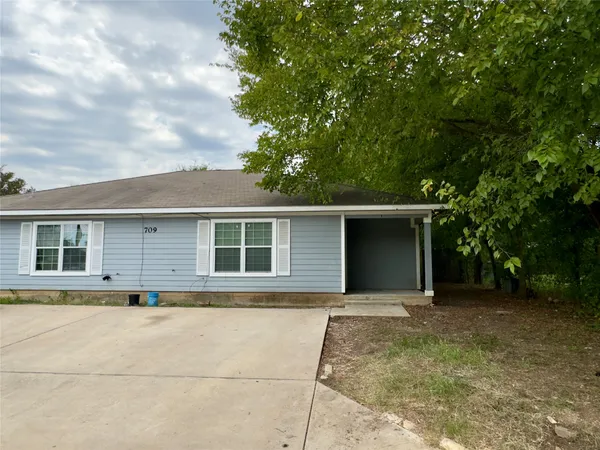 front view of a house with a yard
