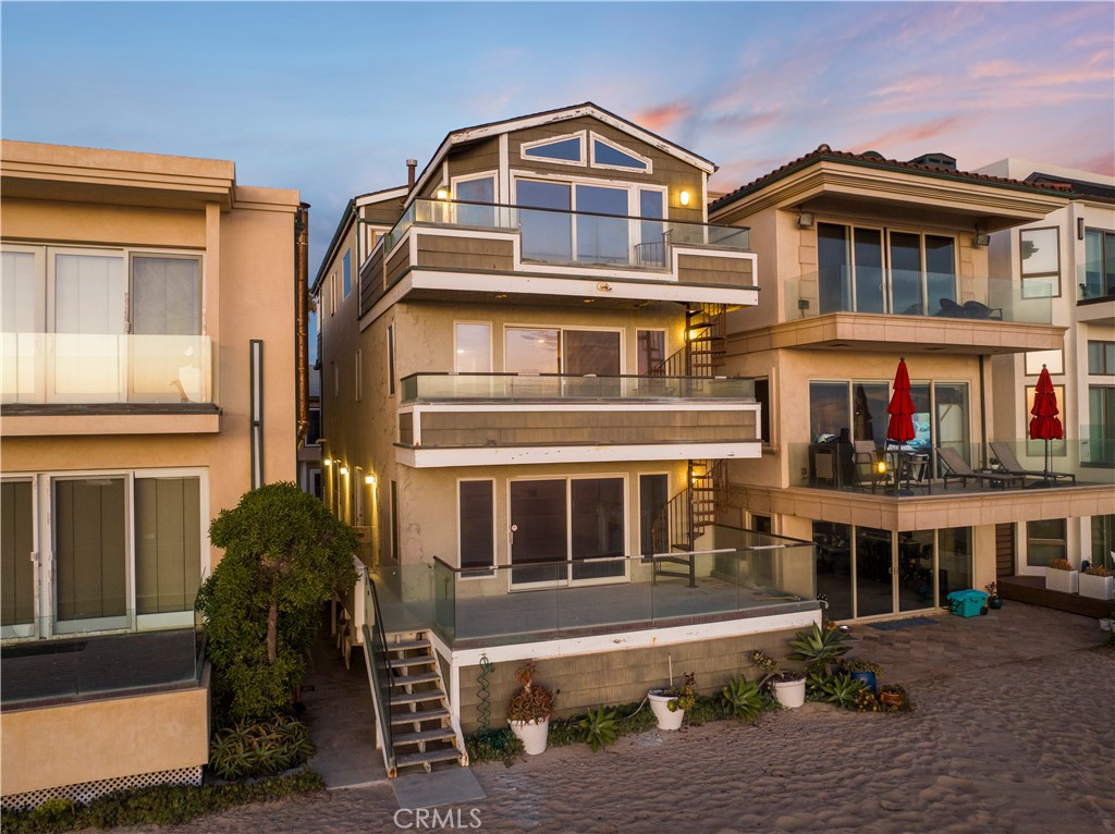 9 Surfside Avenue Surfside, CA 90743 - Photo 1 of 1 a front view of a house with a yard