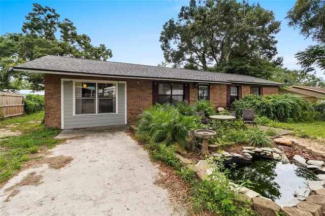 a house with a tree in front of it