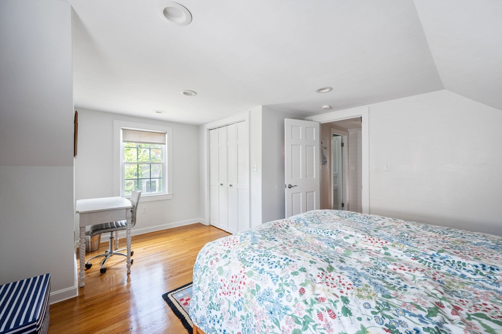 40 Lyman Road Milton, MA 02186 - Photo 14 of 28 a bedroom with a bed and wooden floor