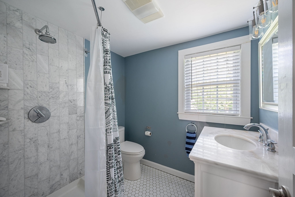40 Lyman Road Milton, MA 02186 - Photo 15 of 28 a bathroom with a sink toilet and shower