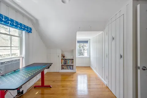 a view of kitchen with furniture and wooden floor