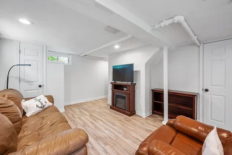 a bedroom with a bed and a television