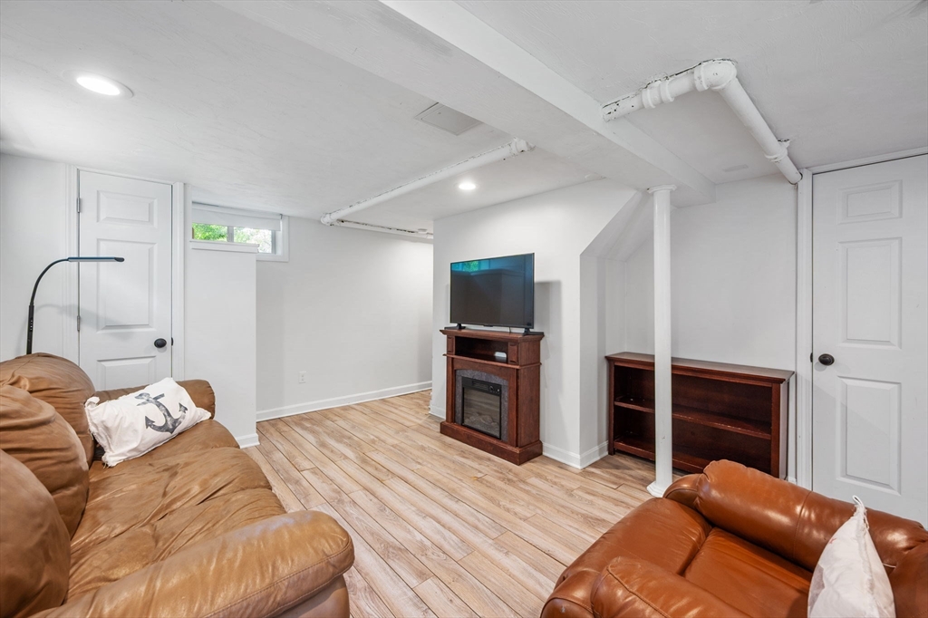 40 Lyman Road Milton, MA 02186 - Photo 19 of 28 a bedroom with a bed and a television