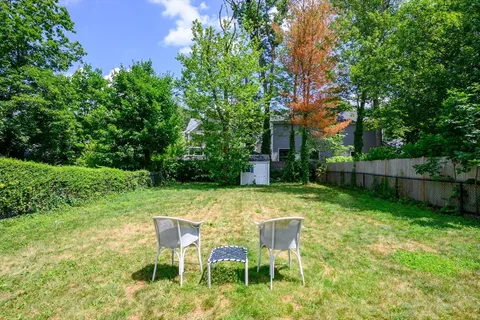 a view of a chair and table in the yard
