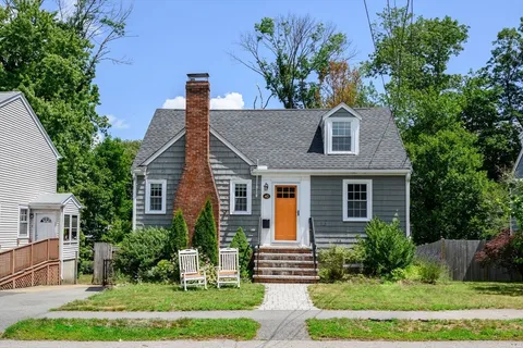 front view of a house with a yard