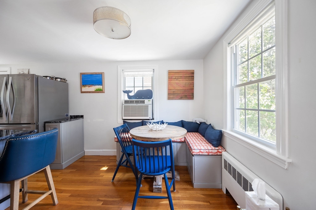 40 Lyman Road Milton, MA 02186 - Photo 6 of 28 a view of a dining room with furniture window and wooden floor