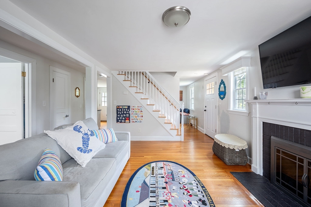 40 Lyman Road Milton, MA 02186 - Photo 10 of 28 a living room with fireplace furniture and a flat screen tv