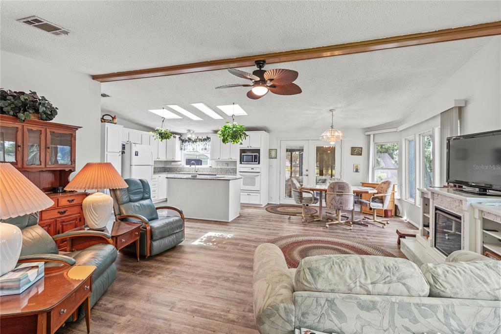 83 Eagle Circle Ellenton, FL 34222 - Photo 23 of 60 a living room with furniture kitchen view and a flat screen tv
