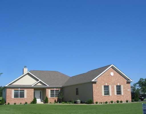 9418 Elizabeth Lane Spring Grove, IL 60081 - Photo 1 of 1 a front view of a house with a yard