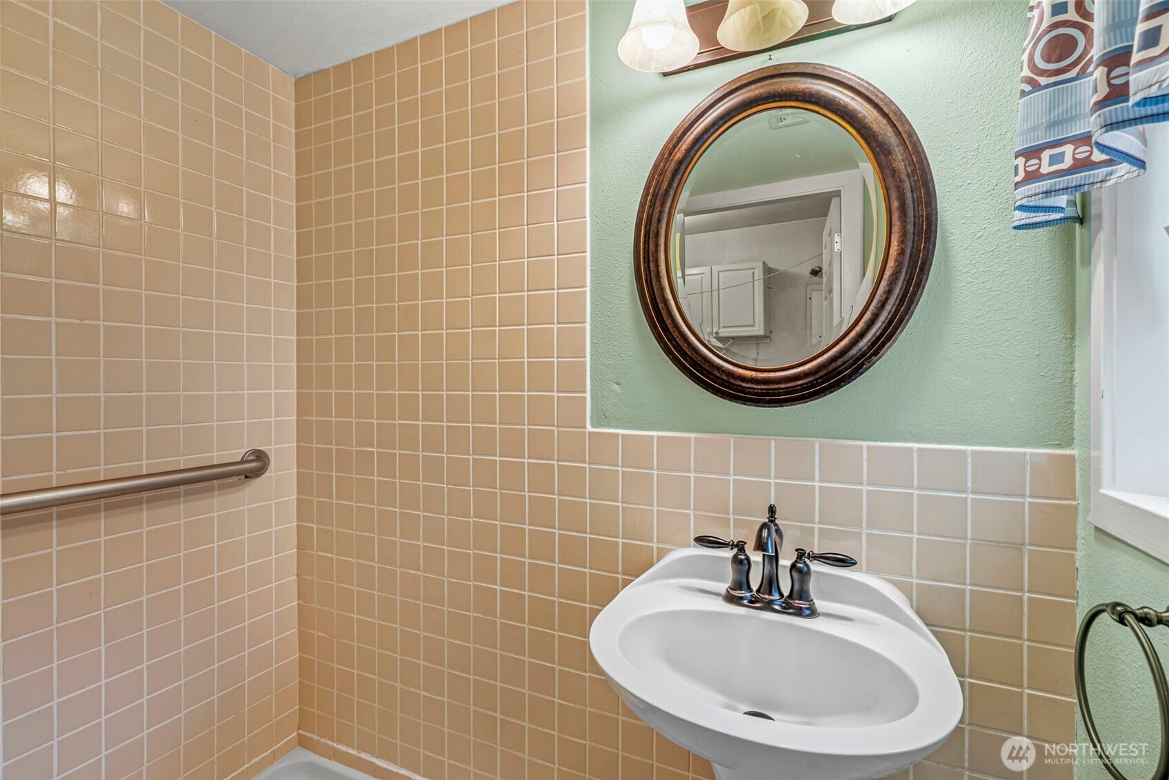 3053 Fir Street Longview, WA 98632 - Photo 13 of 20 a bathroom with a sink a toilet and a mirror