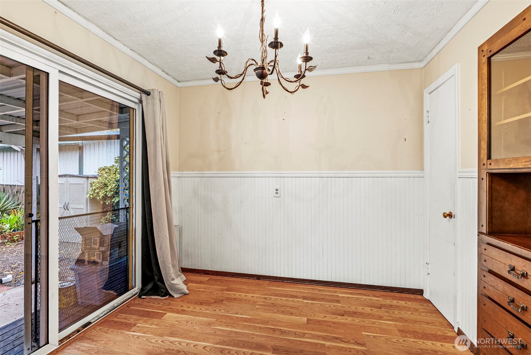 3053 Fir Street Longview, WA 98632 - Photo 14 of 20 a view of a room with wooden floor and cabinet