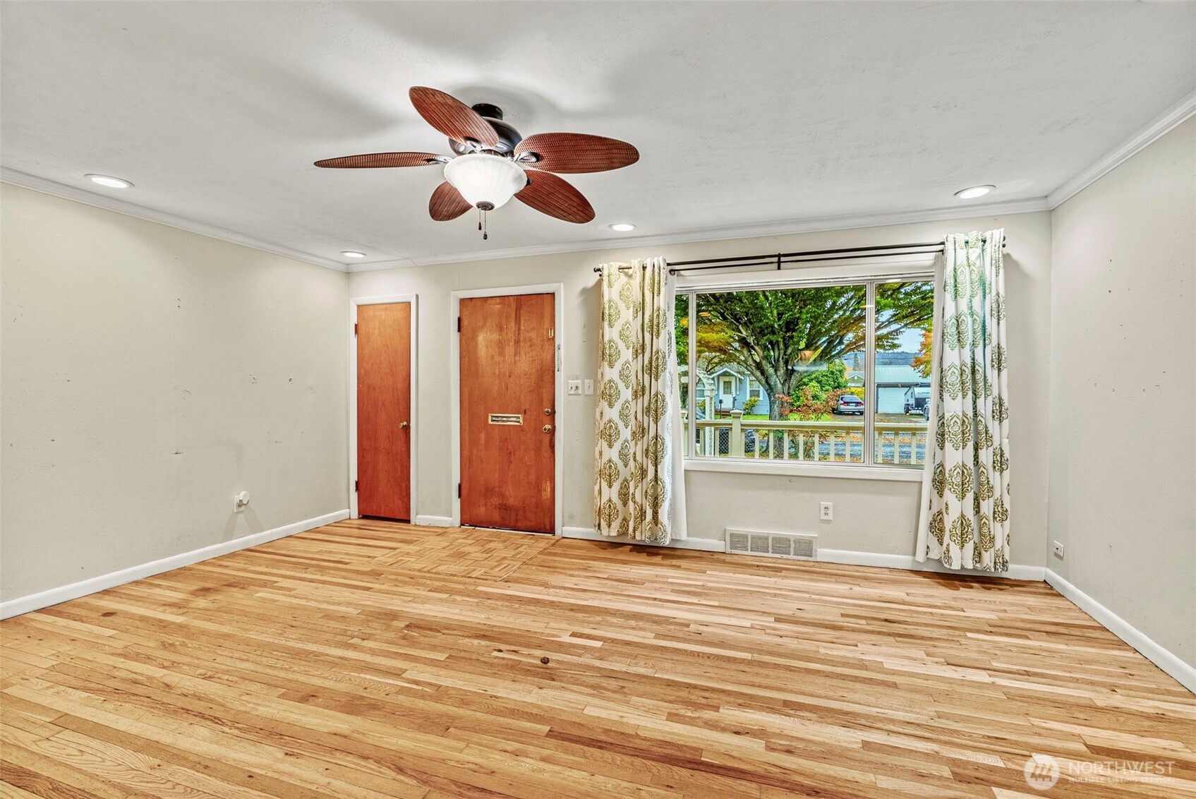 3053 Fir Street Longview, WA 98632 - Photo 4 of 20 a view of an empty room with wooden floor and a window