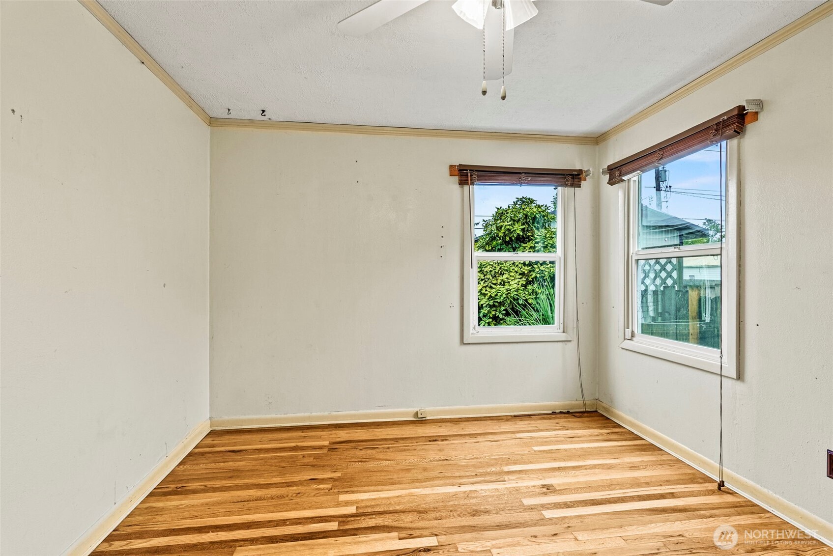 3053 Fir Street Longview, WA 98632 - Photo 5 of 20 a view of an empty room with wooden floor and a window