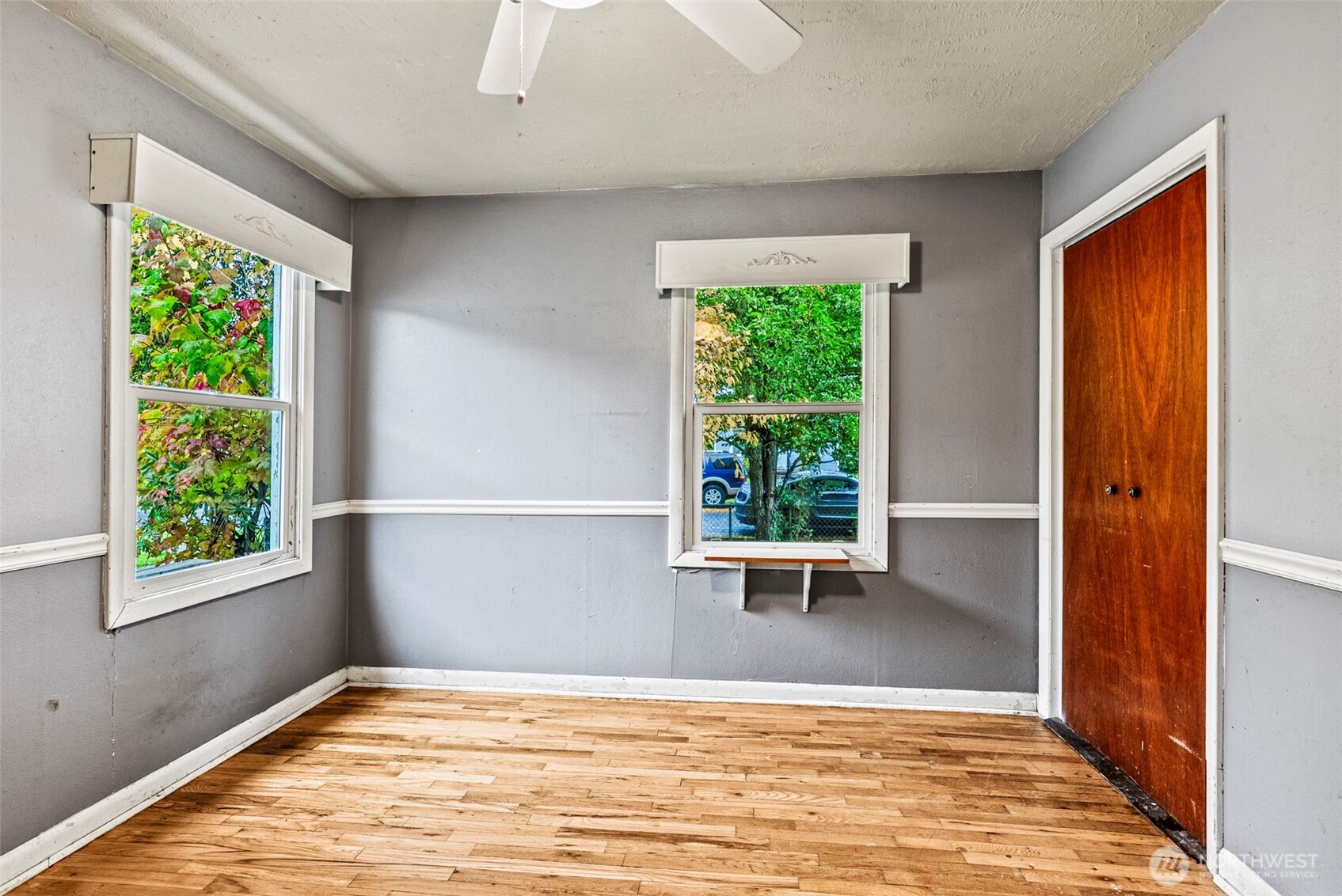 3053 Fir Street Longview, WA 98632 - Photo 6 of 20 a view of an empty room with wooden floor and a window