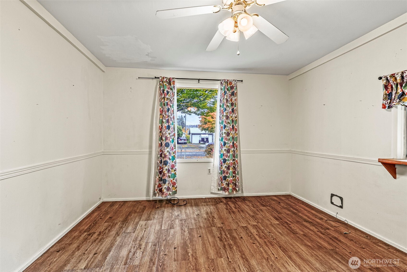 3053 Fir Street Longview, WA 98632 - Photo 8 of 20 an empty room with wooden floor and windows