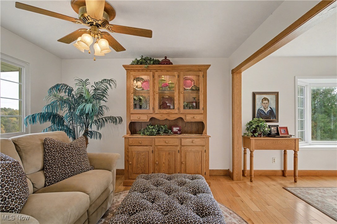 913 Rost Road Walker, WV 26180 - Photo 12 of 48 Sitting room featuring plenty of natural light, light wood-style flooring, and ceiling fan